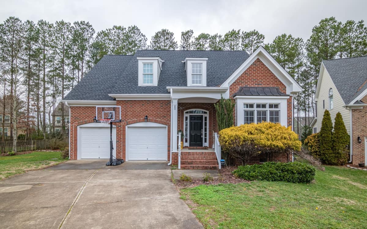 Brick suburban home with a garage in a quiet neighborhood